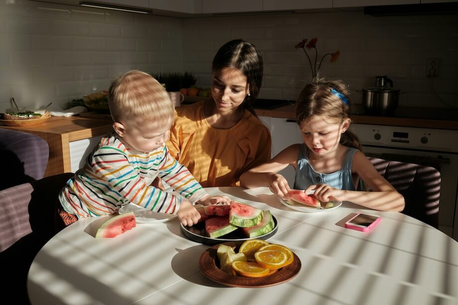 Mother and children sitting at a table